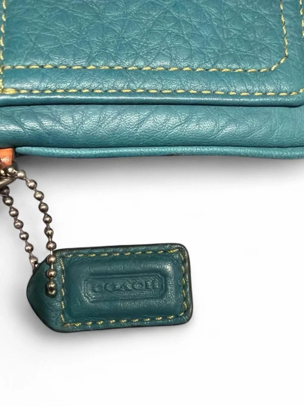 Coach Teal Pebbled Leather Wristlet with Tan Strap Accent